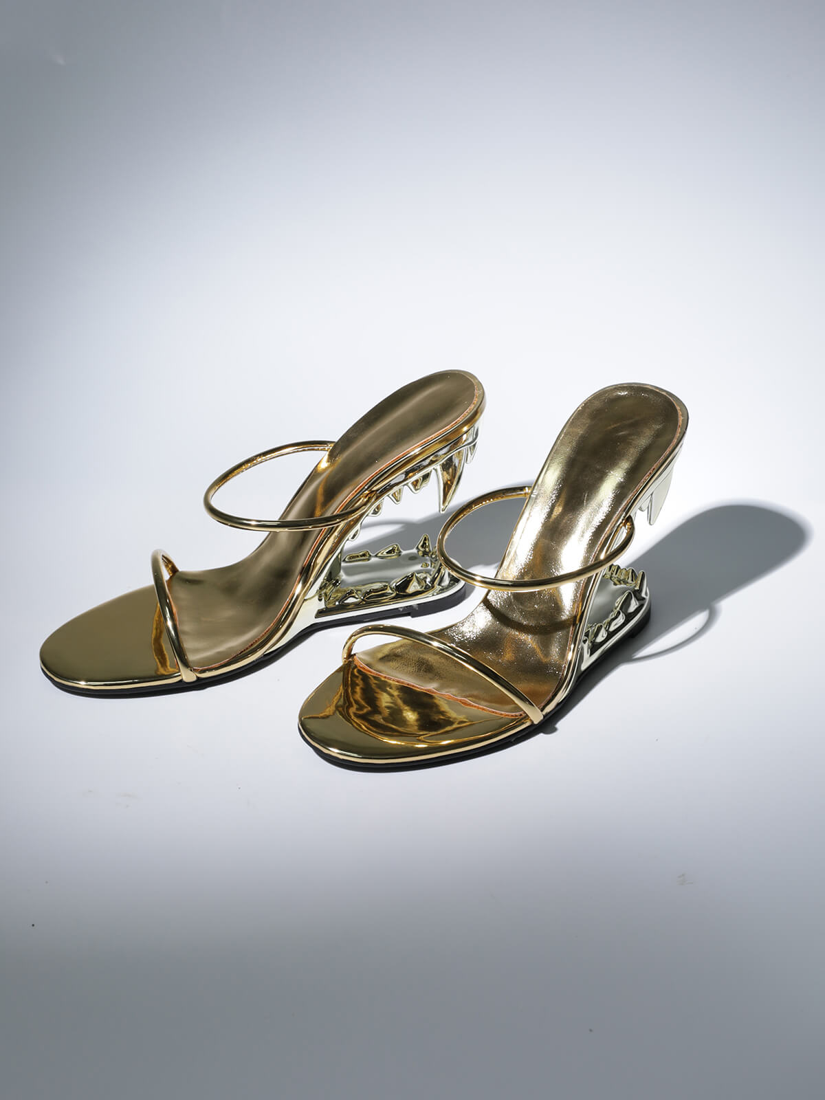Gale Tiger Tooth Cutout Heels In Gold