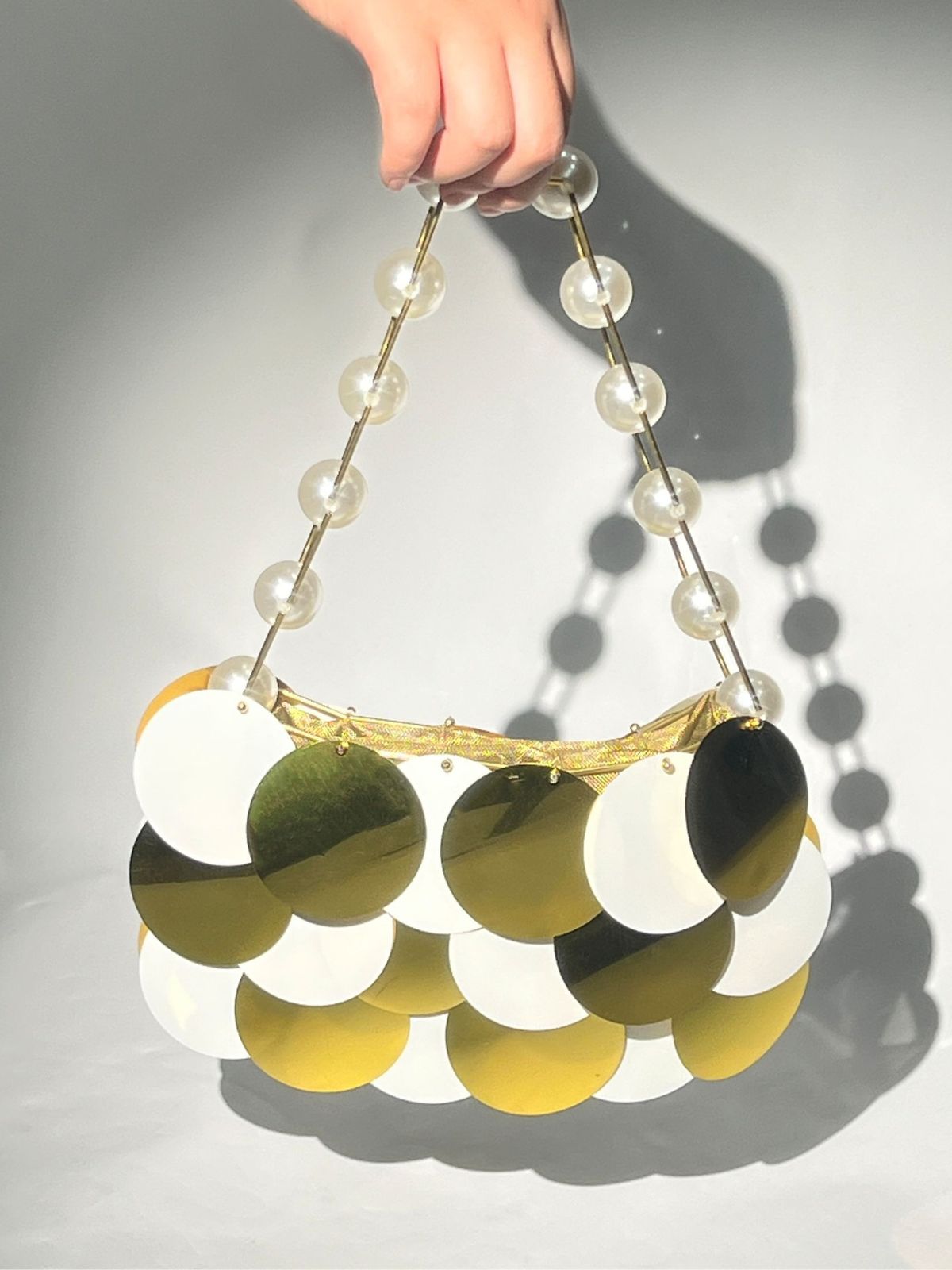 Kuru Circle Embellished Pearl Chain Clutch